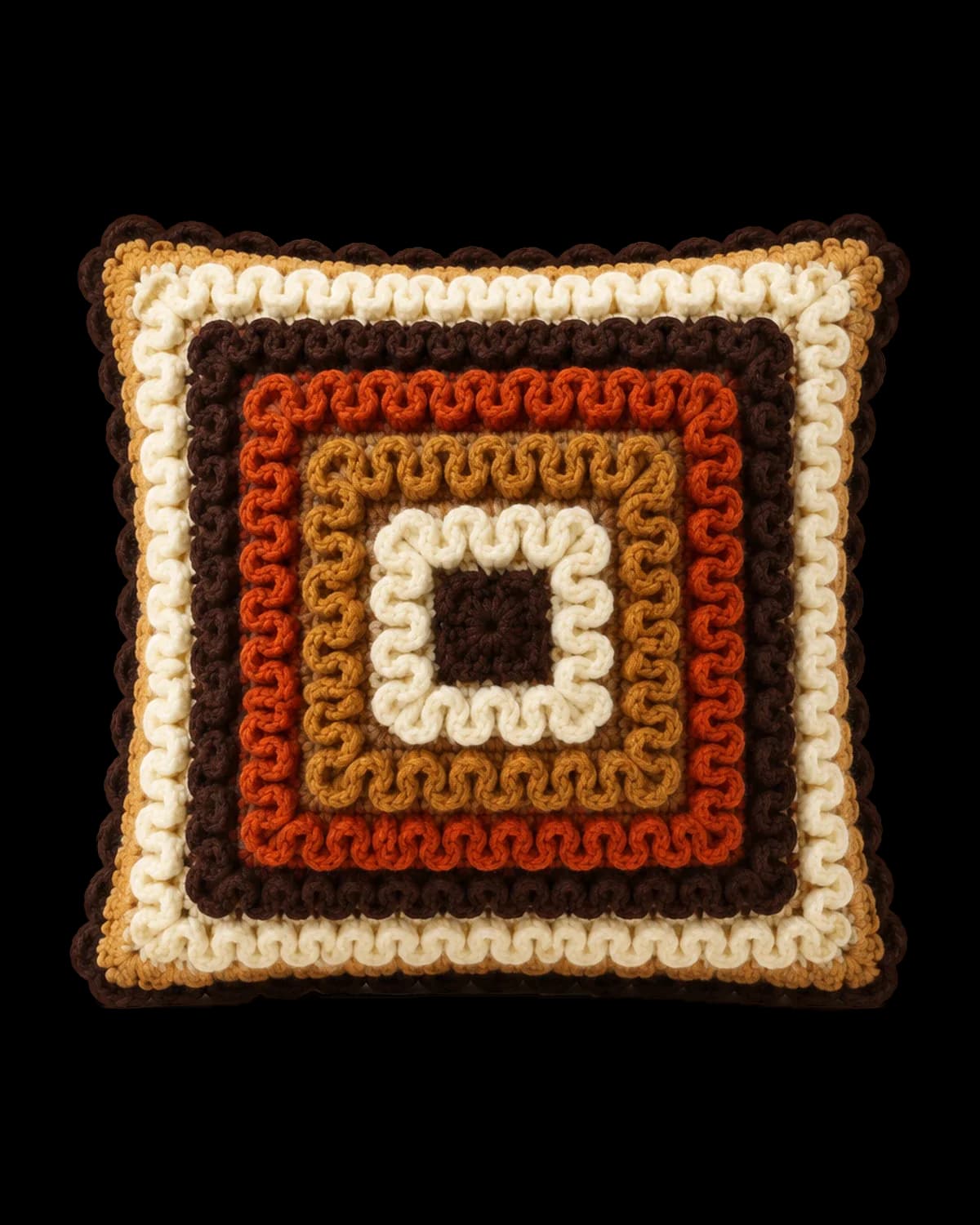 Square crochet cushion in raised wiggle stitch with chocolate, cream, caramel and burnt-orange rings and a scalloped edge