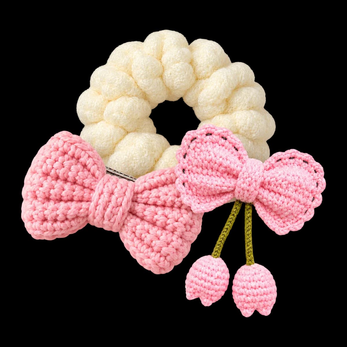 Crochet hair accessories: cream cloud puff scrunchie, pink bow clip and pink bow clip with tulips