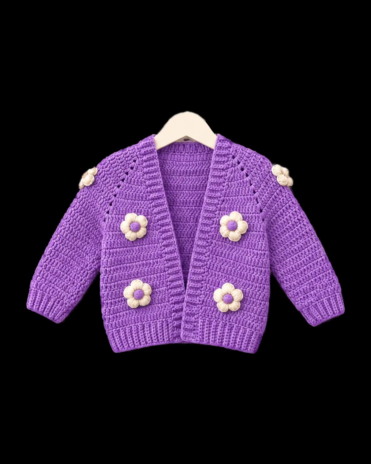 Lavender crochet baby cardigan with ribbed front bands and cream puff-stitch flowers, on a cream hanger