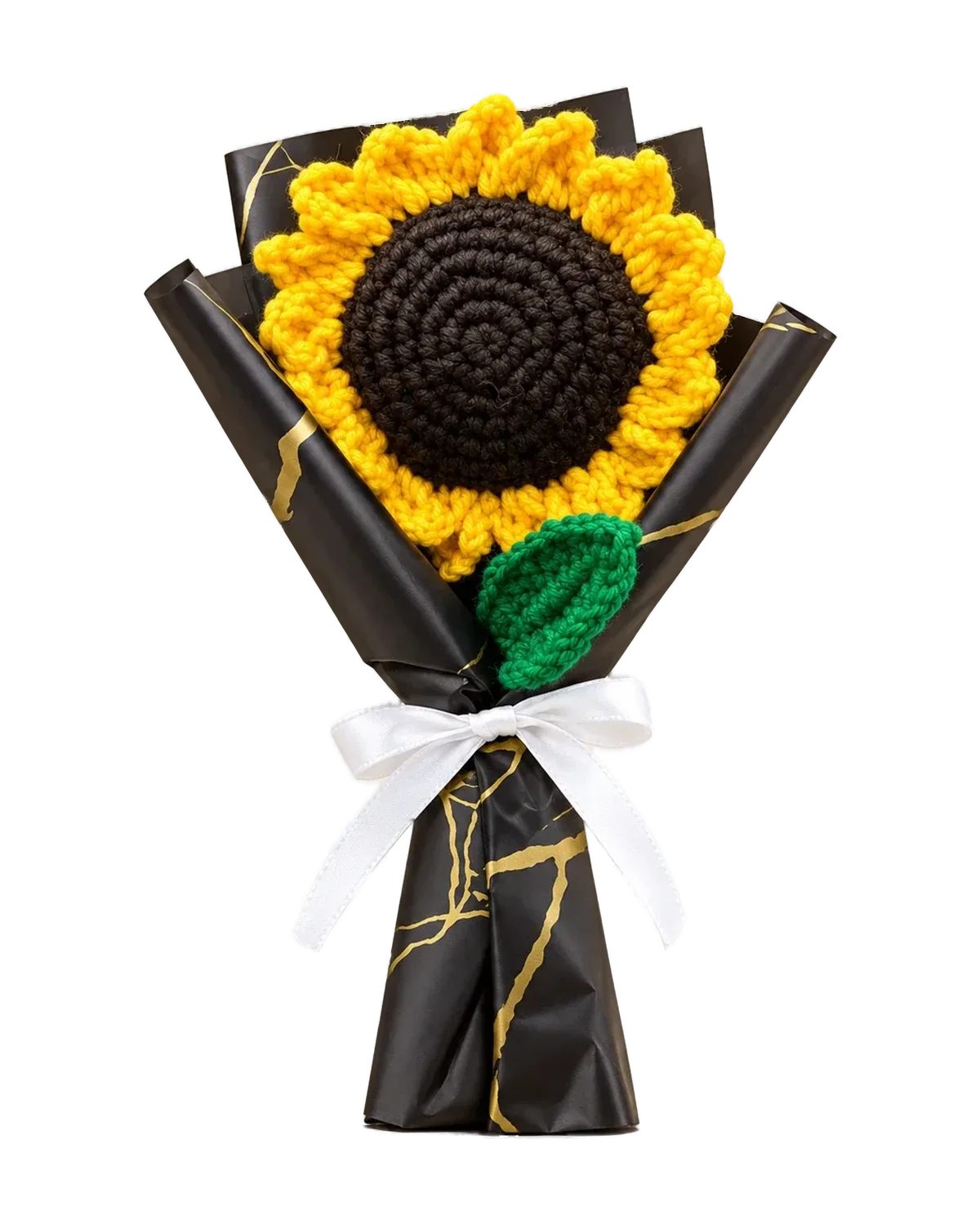Crochet sunflower bouquet wrapped in black and gold paper with a white satin bow